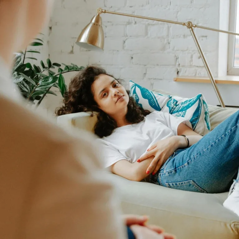 Relationship counseling session with a professional therapist helping couples improve communication and resolve conflicts.